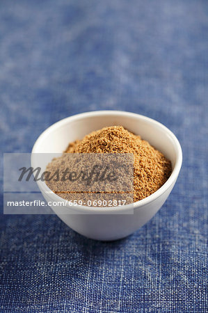 A small bowl of ground cumin