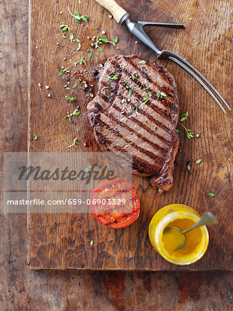 Grilled steak with grilled tomatoes and mustard Grilled steak with grilled tomatoes and mustard