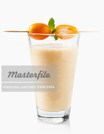 An exotic smoothie with mango and kumquats An exotic smoothie with mango and kumquats