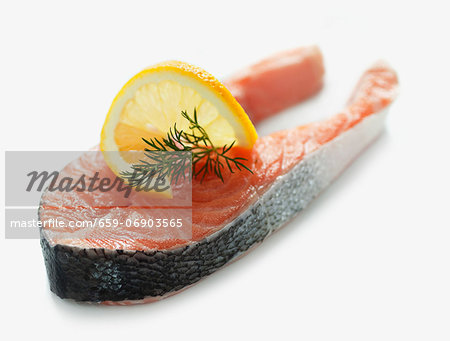 Raw salmon steak with dill and lemon Raw salmon steak with dill and lemon