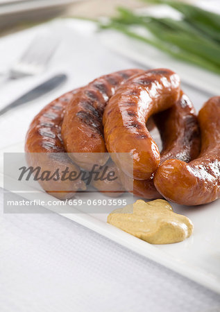 Grilled sausages with mustard