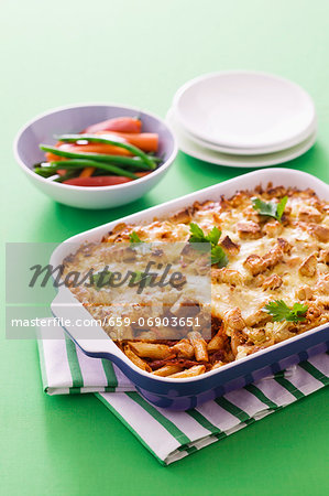 Pasta bake with dried tomatoes, cheese and croutons