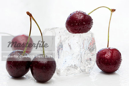 Sweet cherries and an ice cube Sweet cherries and an ice cube
