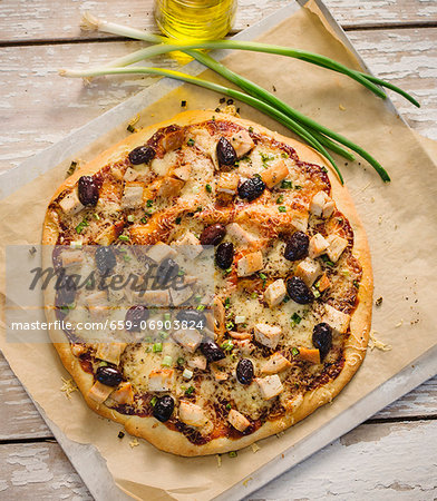 Whole Barbecue Chicken Pizza with Olives; From Above Whole Barbecue Chicken Pizza with Olives; From Above