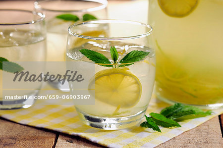 Homemade Country Lemonade garnished with some mint leaves, selective focus Homemade Country Lemonade garnished with some mint leaves, selective focus