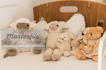 Close-up of stuffed toys on a bed Close-up of stuffed toys on a bed