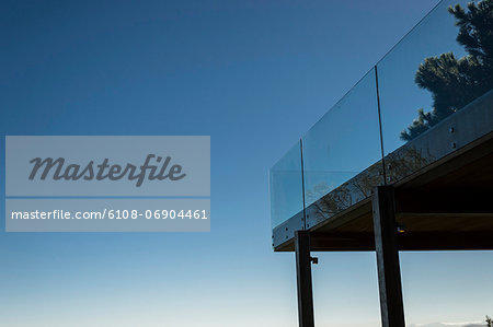 Low angle view of a terrace with glass railing