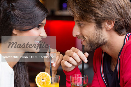 Couple drinking cocktail in a restaurant
