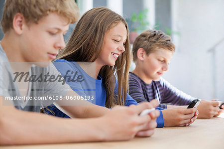 Students using electronic gadget in a classroom