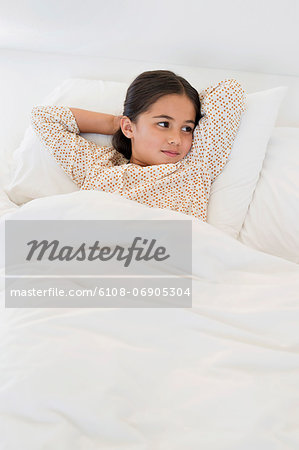 Girl relaxing on the bed