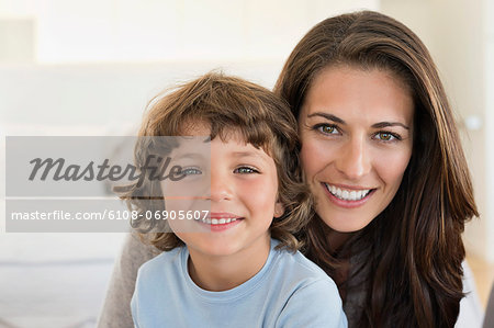 Portrait of a woman and her son smiling