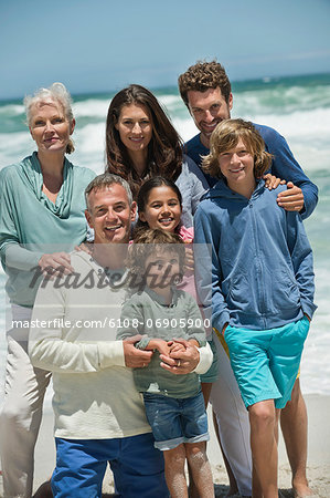 Portrait of a family smiling on the beach