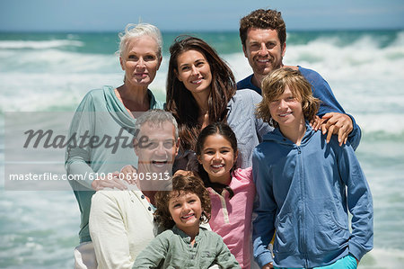 Portrait of a family smiling on the beach