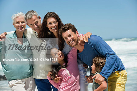 Family smiling on the beach