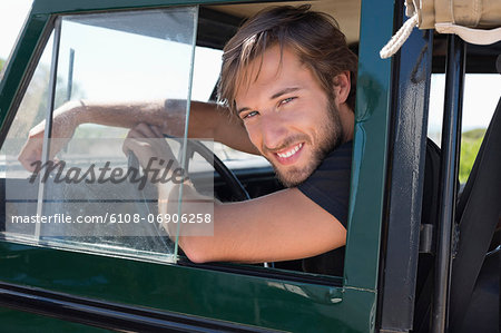 Man smiling in SUV