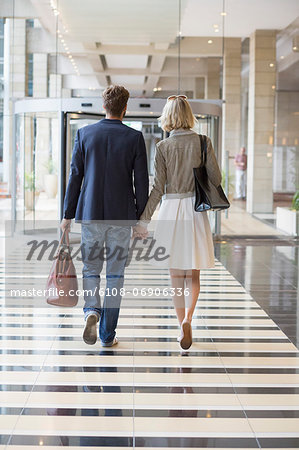 Couple walking at an airport