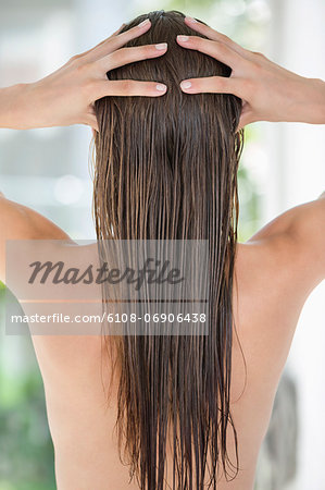 Woman massaging her hair