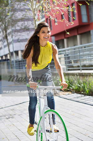 Woman riding a bicycle and smiling