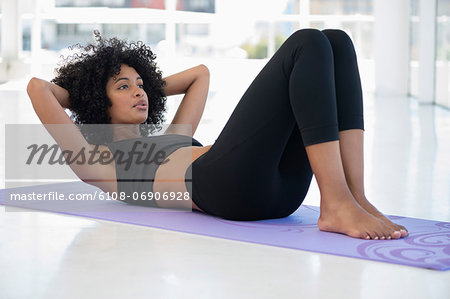 Woman practicing yoga on an exercise mat