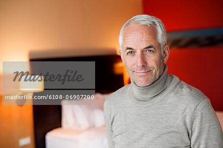 Portrait of a man in a hotel room