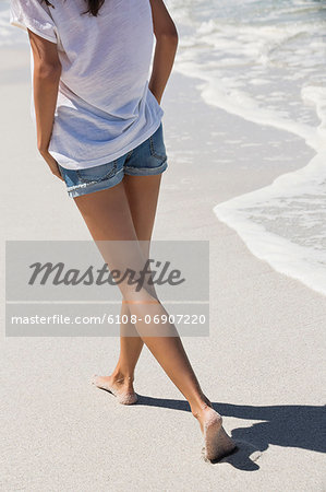 Woman walking on the beach