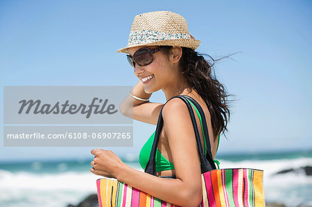 Beautiful woman smiling on the beach Beautiful woman smiling on the beach