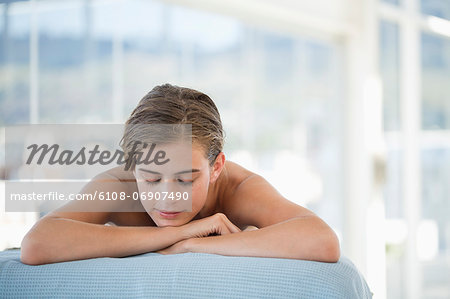 Woman lying on a massage table