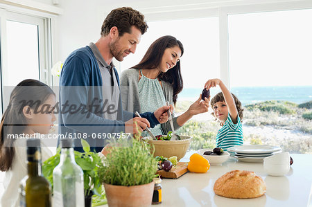 Family preparing food in the kitchen