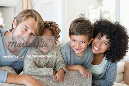 Portrait of a couple smiling with their children