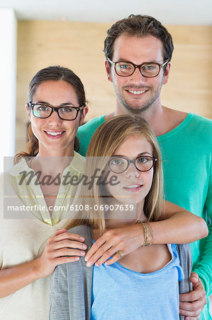 Portrait of a family wearing eyeglasses and smiling