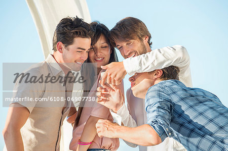 Group of friends looking at a smartphone