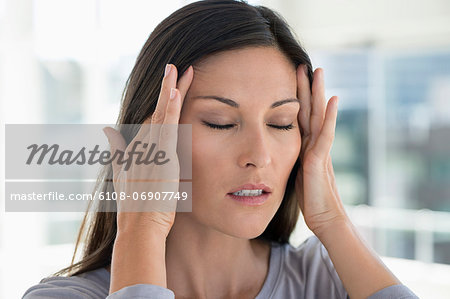 Close-up of a woman suffering from a headache