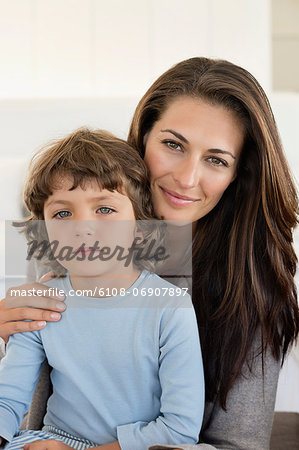 Portrait of a woman smiling with her son