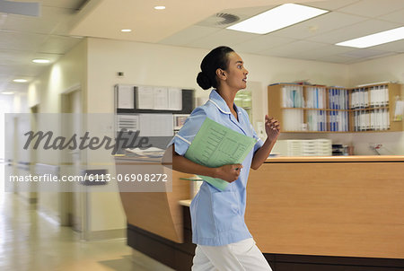 Nurse rushing in hospital hallway