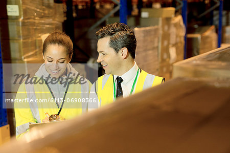 Workers talking in warehouse