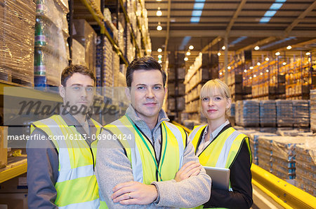 Workers smiling in warehouse