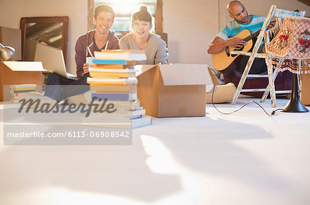 Friends relaxing together in new attic