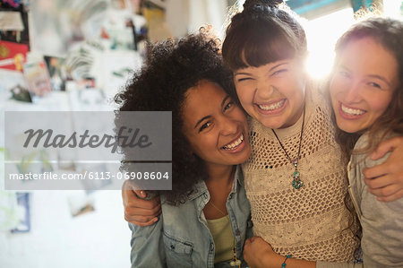 Women smiling together indoors