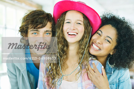 Friends smiling together indoors