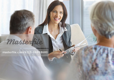 Financial advisor talking to clients in office