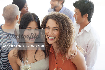 Women smiling together at party