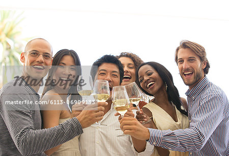 Friends toasting each other at party