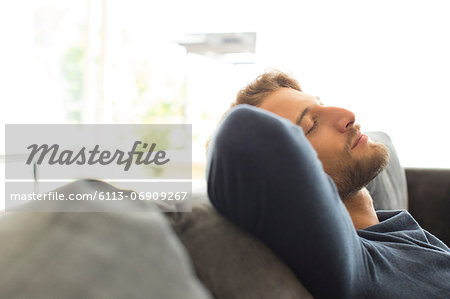 Man relaxing on sofa