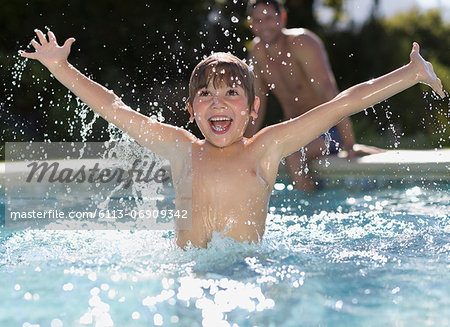 Boy playing in swimming pool