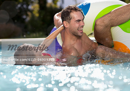 Couple playing in swimming pool