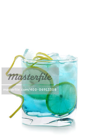 Blue alcohol cocktail with lemon slices isolated on white background
