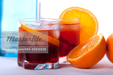 Americano and Negroni cocktails with orange