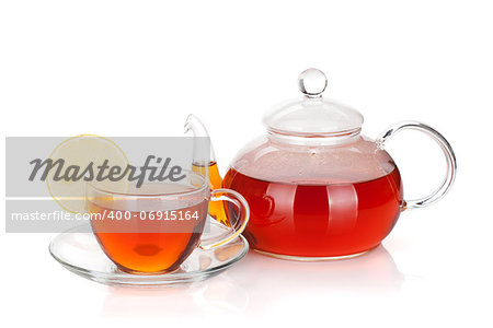 Glass teapot and cup of black tea with lemon slice. Isolated on white background