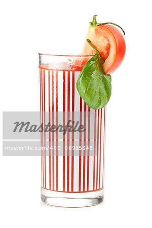 Fresh tomato juice with basil isolated on white background