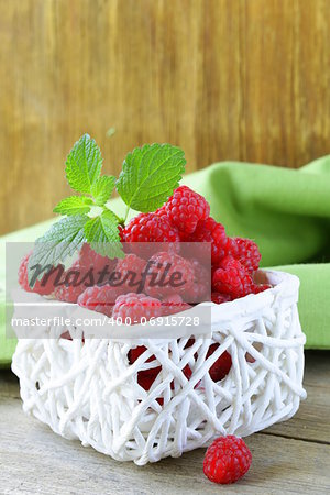 ripe fresh organic raspberries in the basket